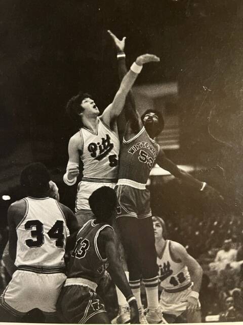 Former UNLV women's basketball coach Jim Bolla, jumping at left, shown while playing college ba ...