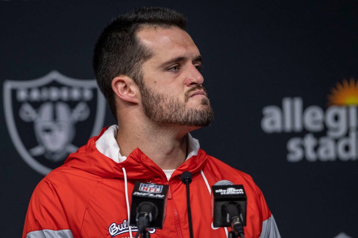 Raiders quarterback Derek Carr frowns during a post-game news conference following a 25-20 loss ...