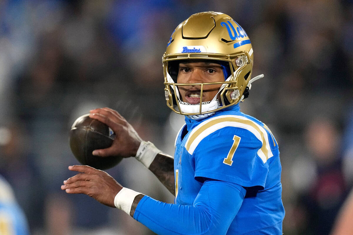 UCLA quarterback Dorian Thompson-Robinson passes during the first half of an NCAA college footb ...