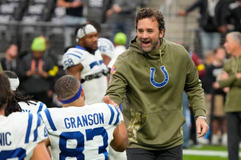 Indianapolis Colts head coach Jeff Saturday warms up before a NFL football game against the Las ...