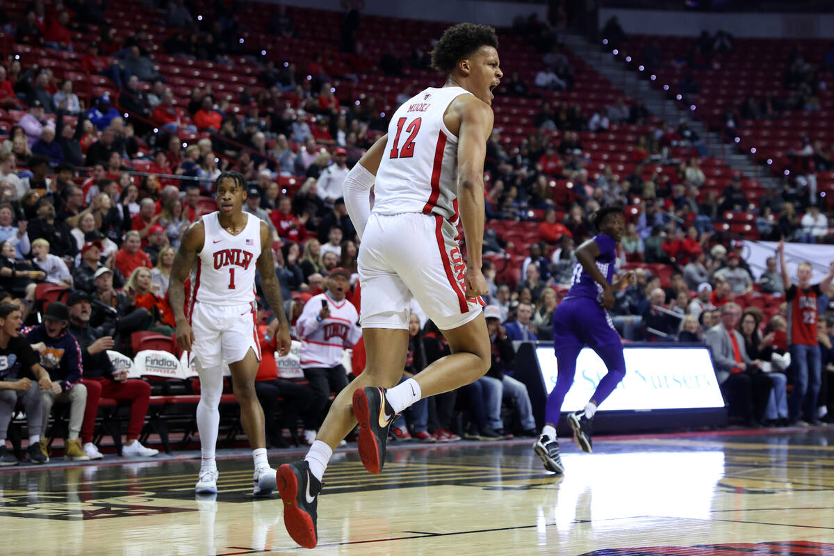 UNLV Rebels center David Muoka (12) reacts after scoring during the first half of an NCAA colle ...