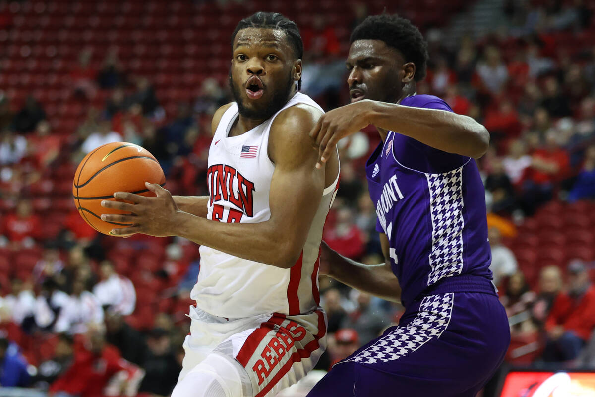 UNLV Rebels guard EJ Harkless (55) looks for an open shot under pressure from High Point Panthe ...