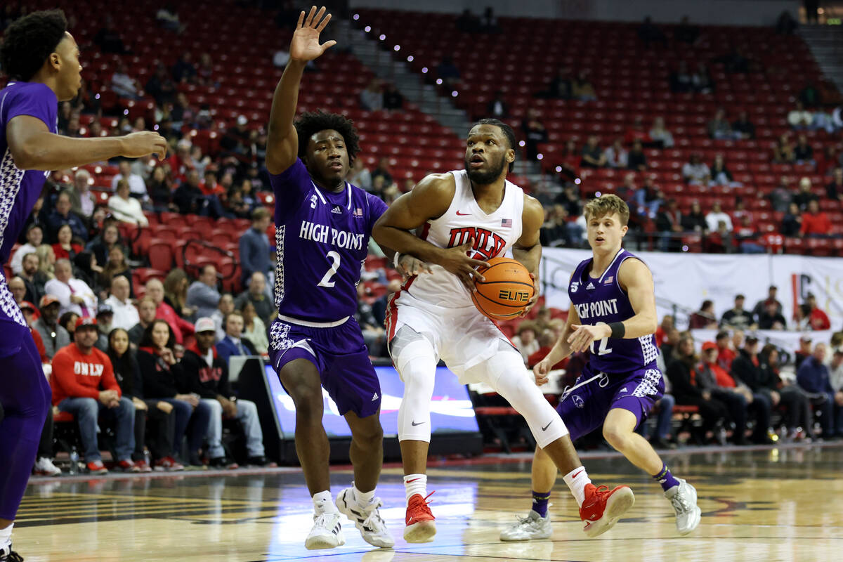 UNLV Rebels guard EJ Harkless (55) looks for an open shot under pressure from High Point Panthe ...