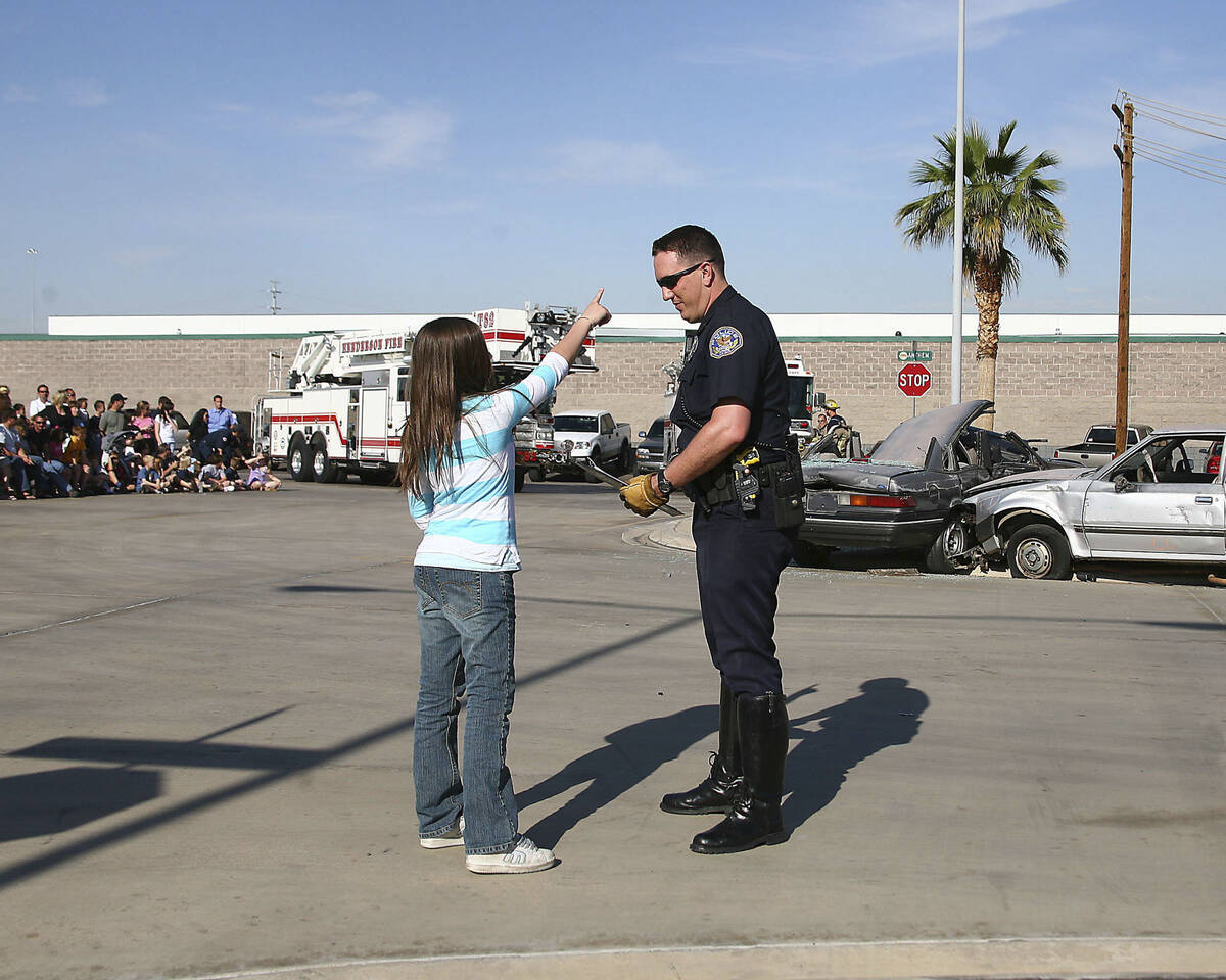 Former traffic officer Gary Hargis is shown in 2007 talking to a witness who showed where a sus ...