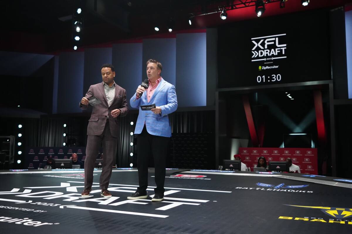 Russ Brandon, right, the XFL’s president of football operations, speaks during the XFL draft ...
