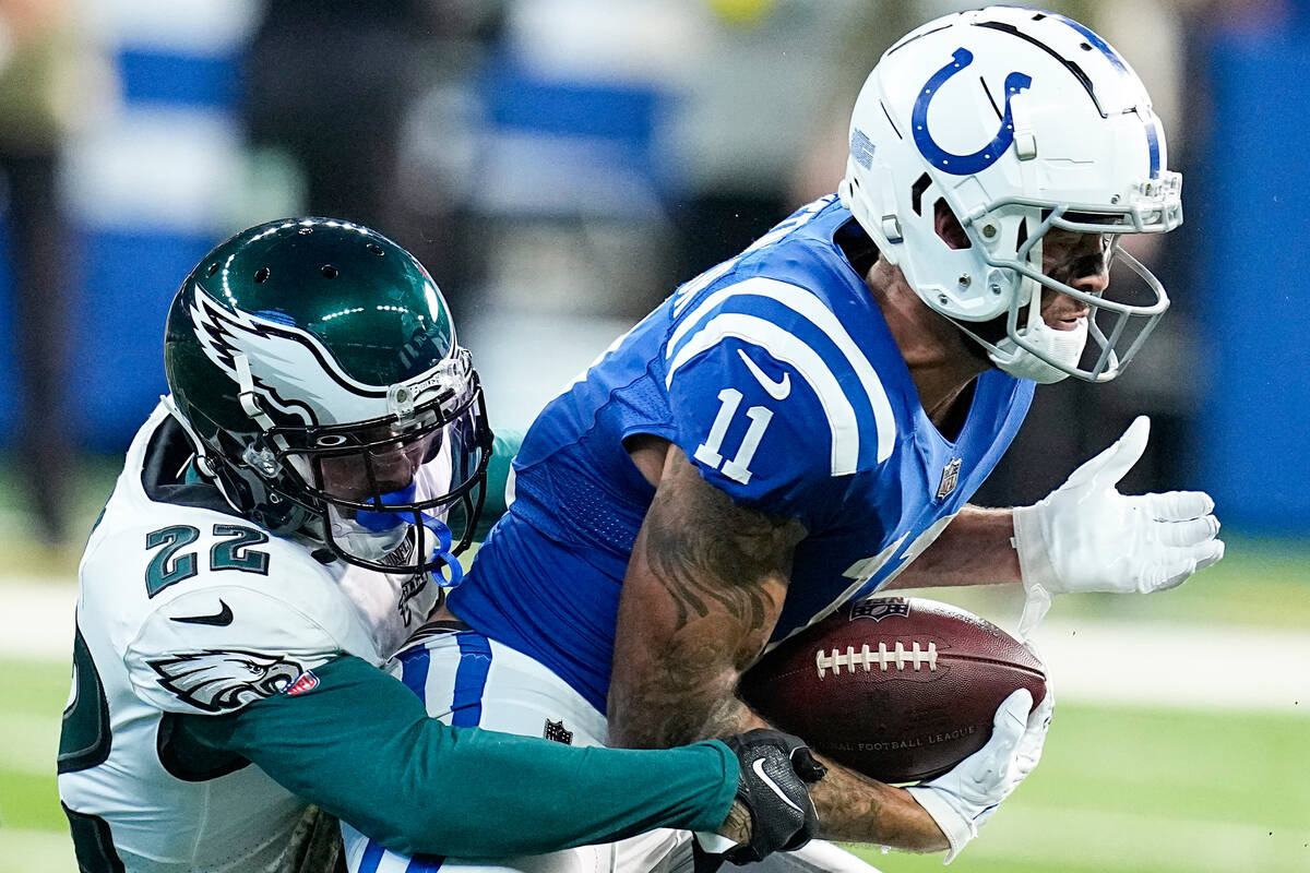 Philadelphia Eagles safety Marcus Epps (22) tackles Indianapolis Colts wide receiver Michael Pi ...