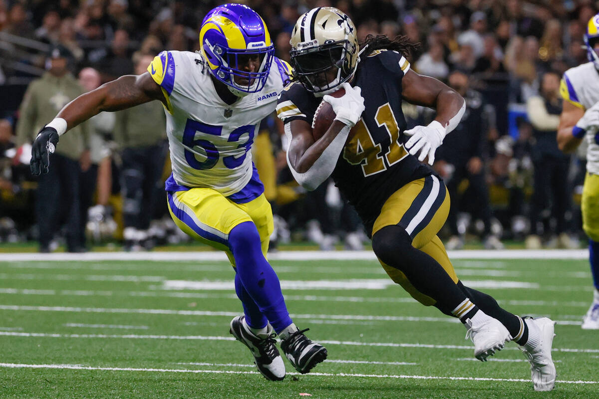 New Orleans Saints running back Alvin Kamara (41) tries to get past Los Angeles Rams linebacker ...