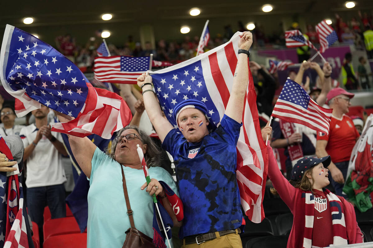 USA supporters cheer at the end of the World Cup, group B soccer match between the United State ...