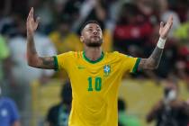 FILE - Brazil's Neymar celebrates after scoring his side's opening goal from the penalty spot d ...