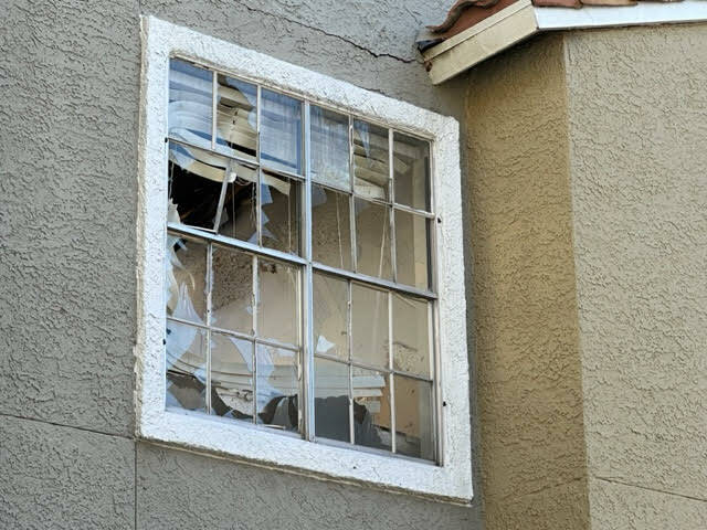 Broken windows at Bella Solana Apartment Homes at 7101 Smoke Ranch Road, after a morning fire d ...