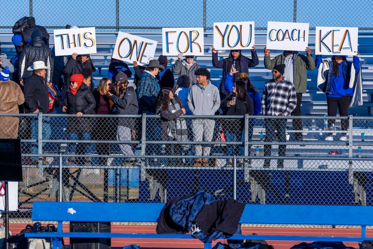 Bishop Gorman fans honor offensive line coach Kea Toledo who didn't make the trip due to a heal ...