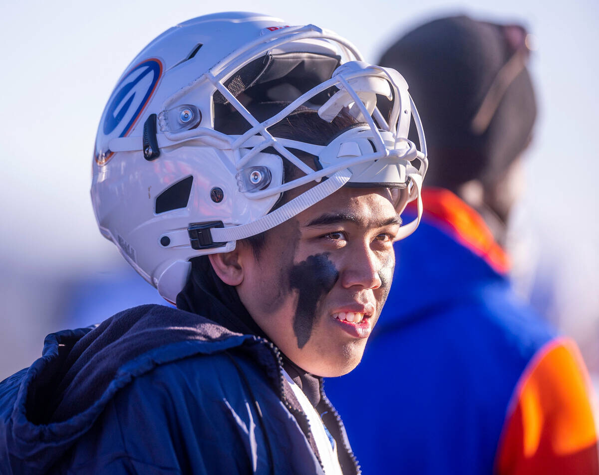 Bishop Gorman QB Micah Alejado (12) looks on from the sidelines as they dominate Bishop Manogue ...