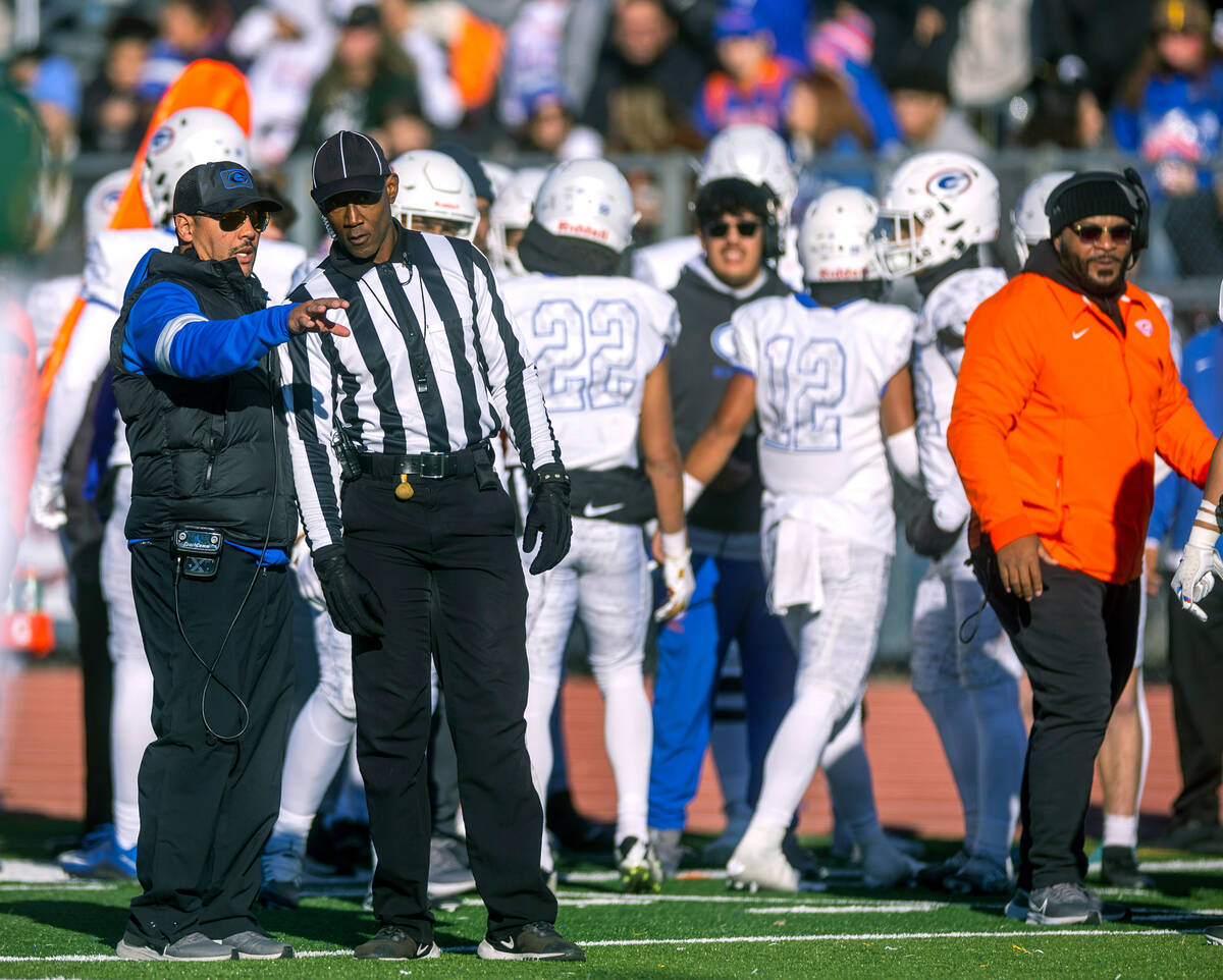Bishop Gorman head coach Brent Browner confers with an official during the second half of their ...