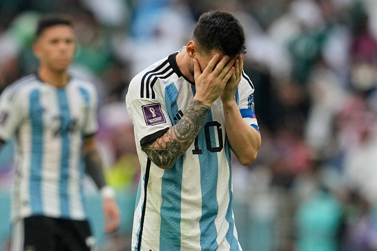 Argentina's Lionel Messi reacts after missing a chance during the World Cup group C soccer matc ...