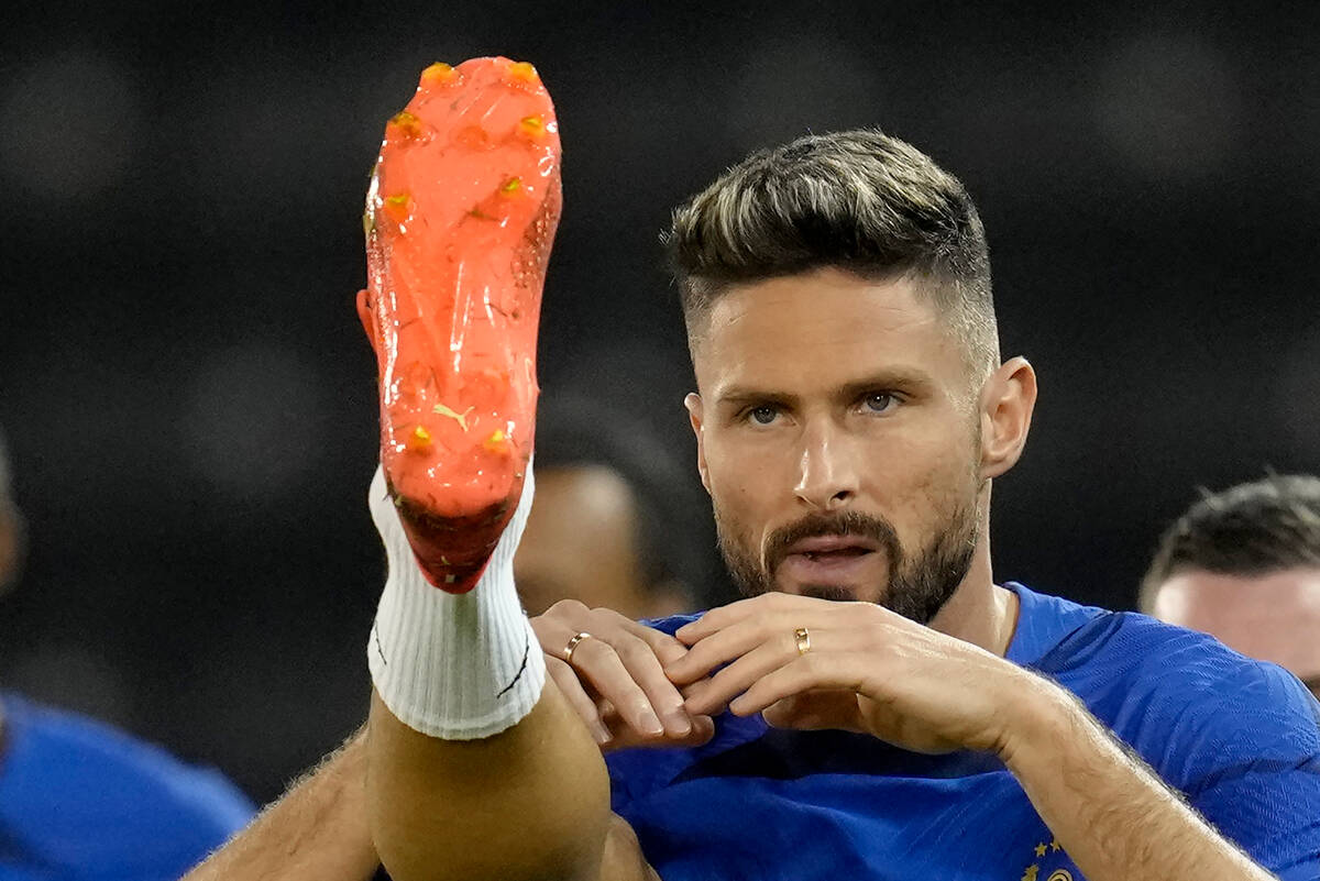 France's Olivier Giroud warms up during a training session at the Jassim Bin Hamad stadium in D ...