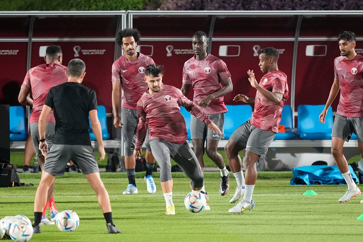Players exercise during Qatar's official training on the eve of the group A World Cup soccer ma ...