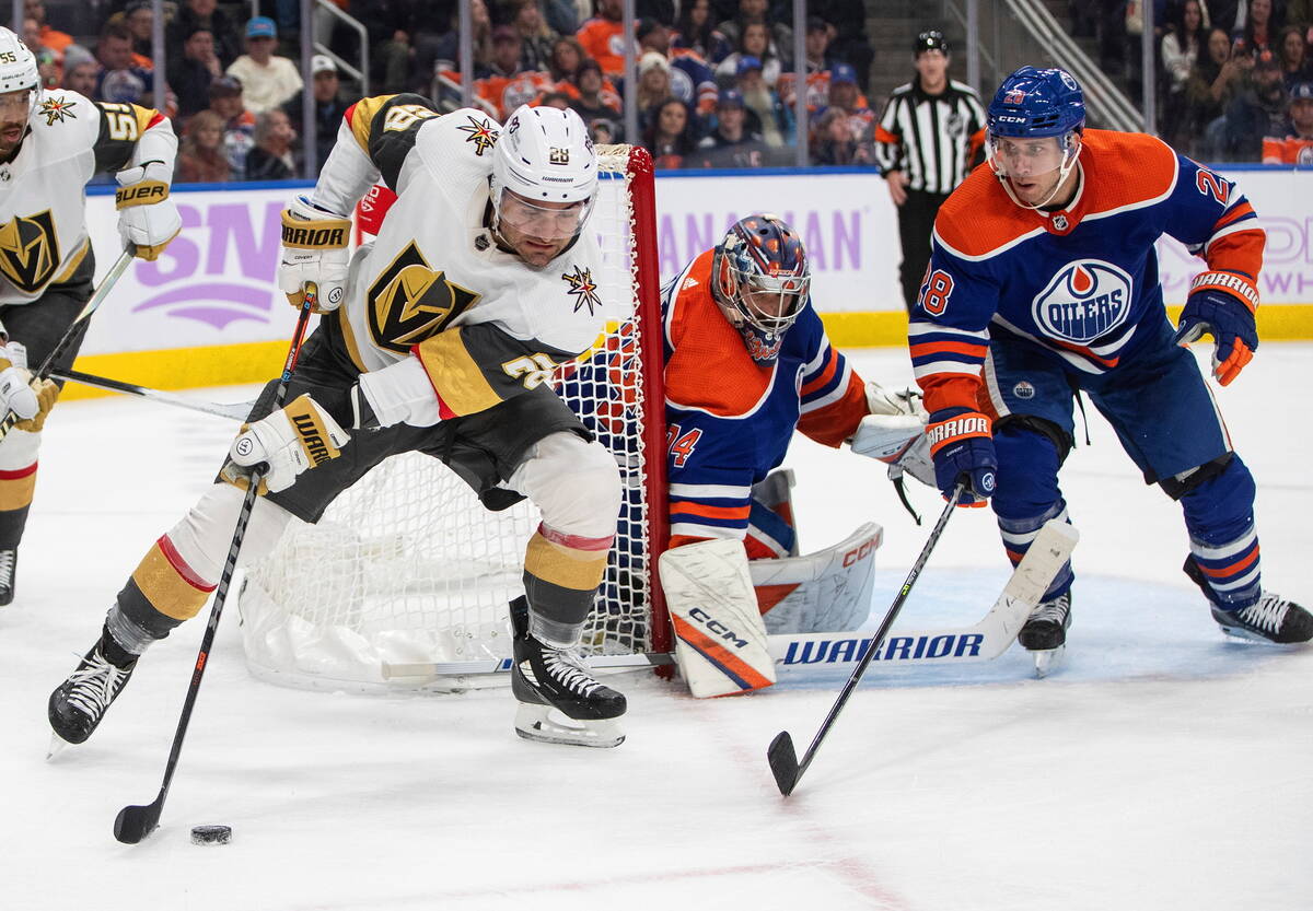 Vegas Golden Knights' William Carrier (28) looks for a shot on Edmonton Oilers goalie Stuart Sk ...