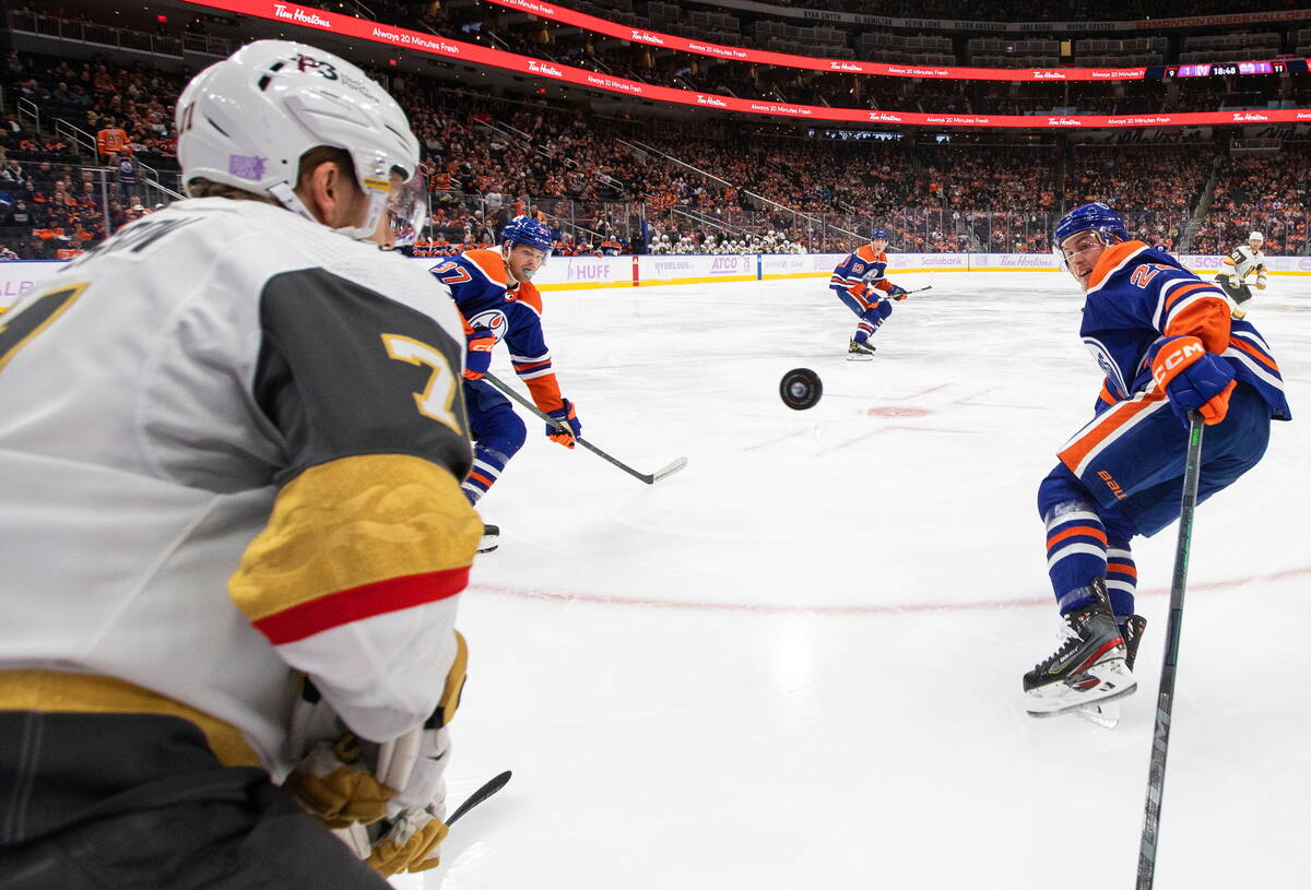 Vegas Golden Knights' William Karlsson (71) and Edmonton Oilers' Warren Foegele (37) and Tyson ...