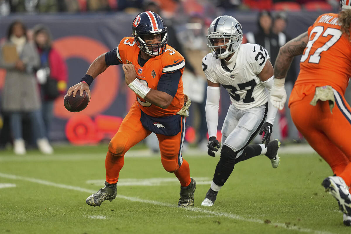 Las Vegas Raiders' Tyler Hall (37) rushes in to sack Denver Broncos quarterback Russell Wilson ...
