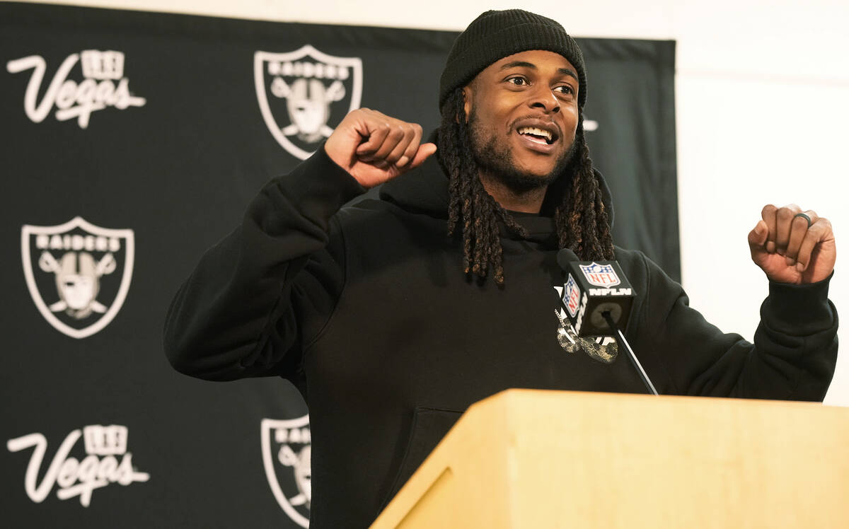 Las Vegas Raiders wide receiver Davante Adams responds to a question during a news conference a ...