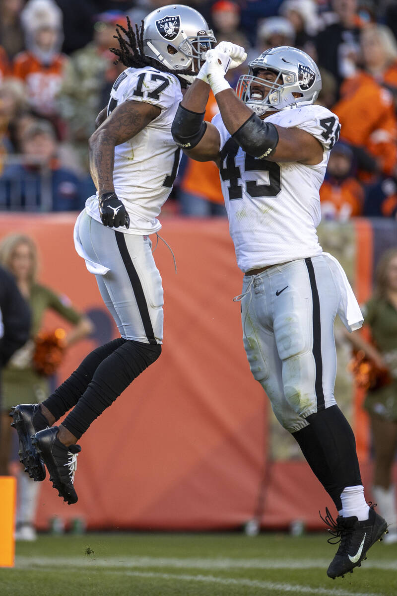 Raiders wide receiver Davante Adams (17) celebrates his touchdown with fullback Jakob Johnson ( ...