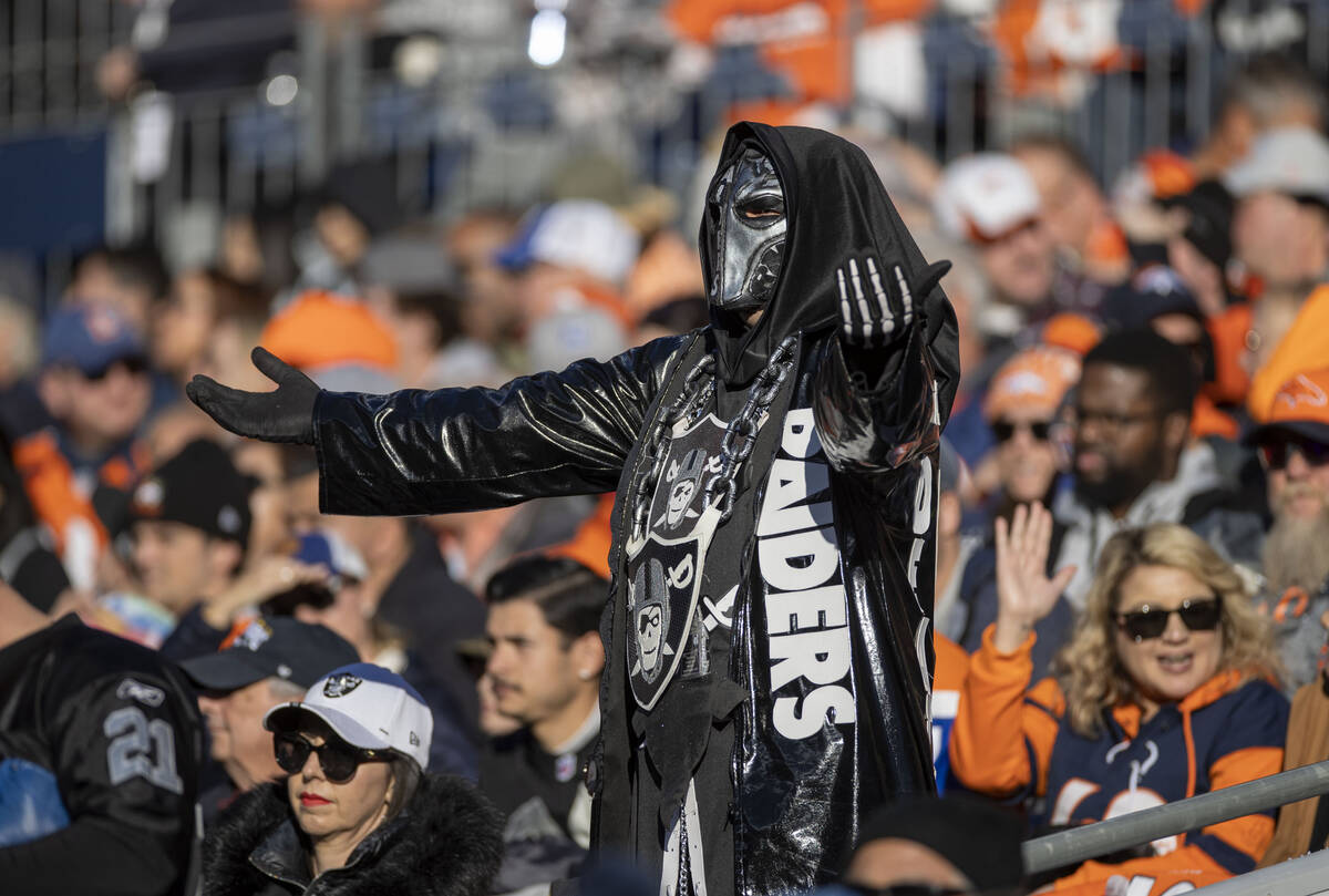 A Raiders fan cheers during the first half of an NFL game against the Denver Broncos at Empower ...
