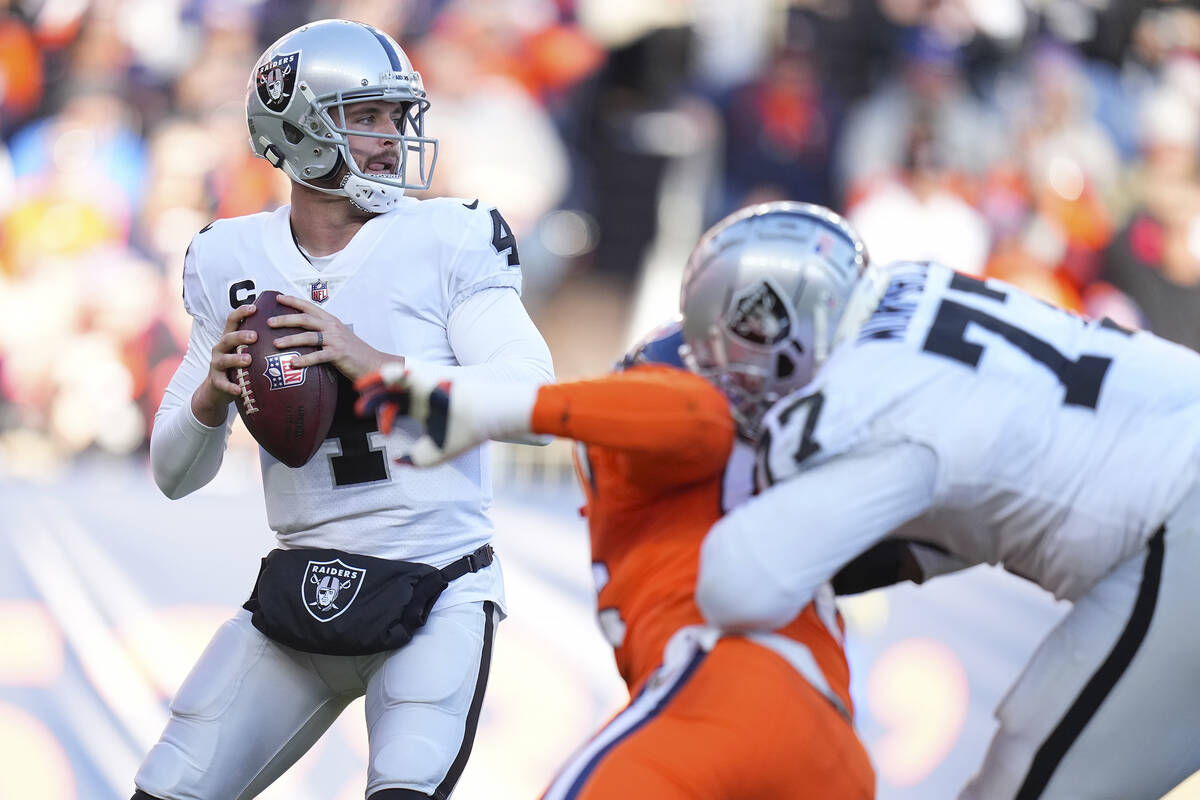 Las Vegas Raiders quarterback Derek Carr (4) passes against the Denver Broncos during the first ...