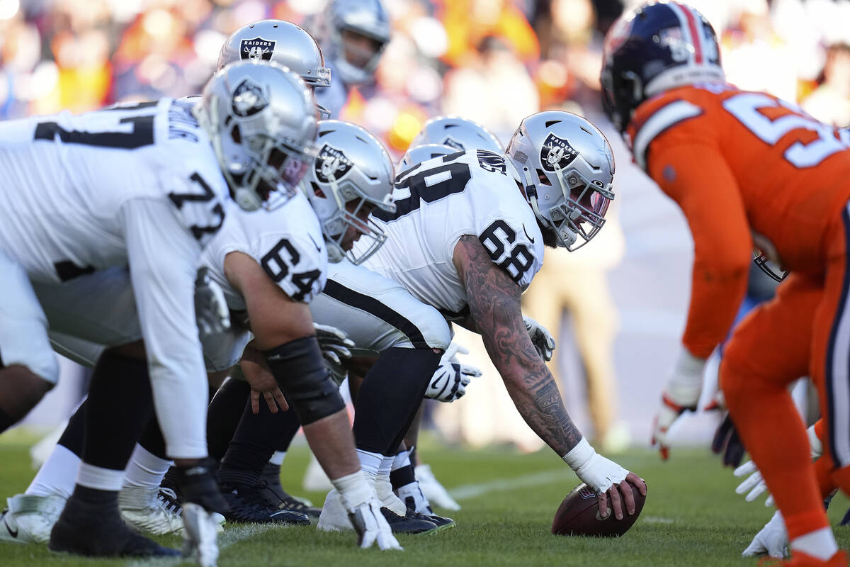 Las Vegas Raiders center Andre James (68) centers the ball at the line of scrimmage during an N ...