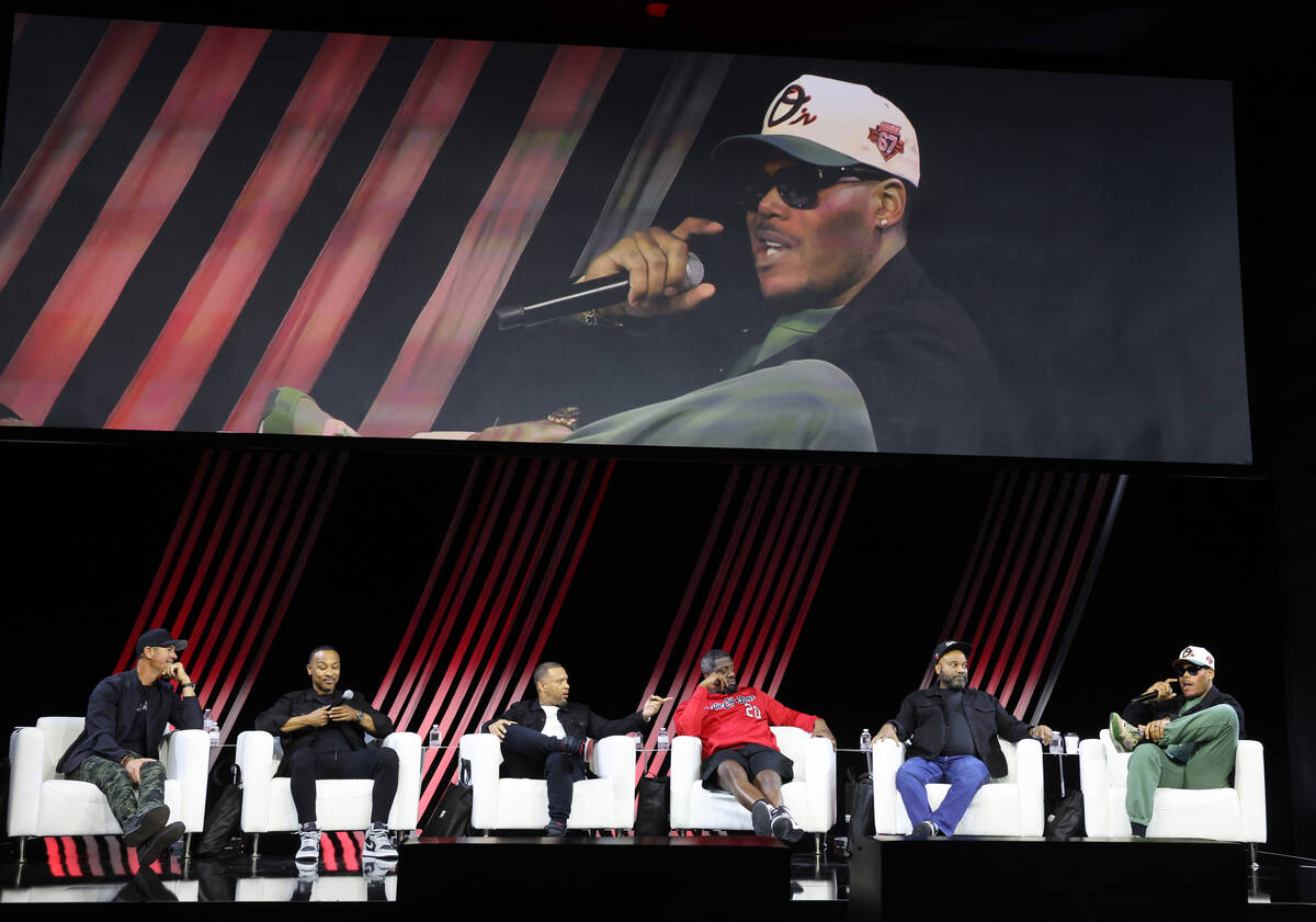 Chris Jacobs, left, hosts members of Kevin Hart’s Muscle Car Crew during the keynote on ...