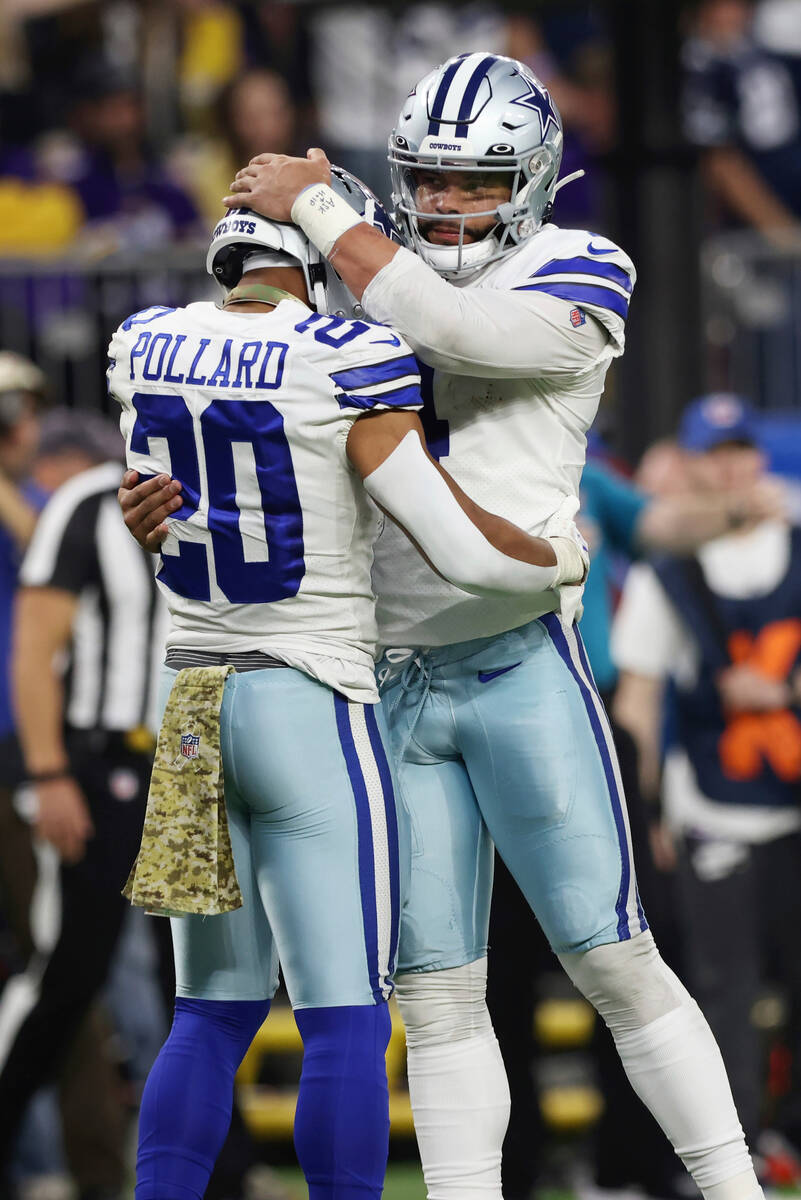 Dallas Cowboys quarterback Dak Prescott (4) celebrates with running back Tony Pollard (20) afte ...