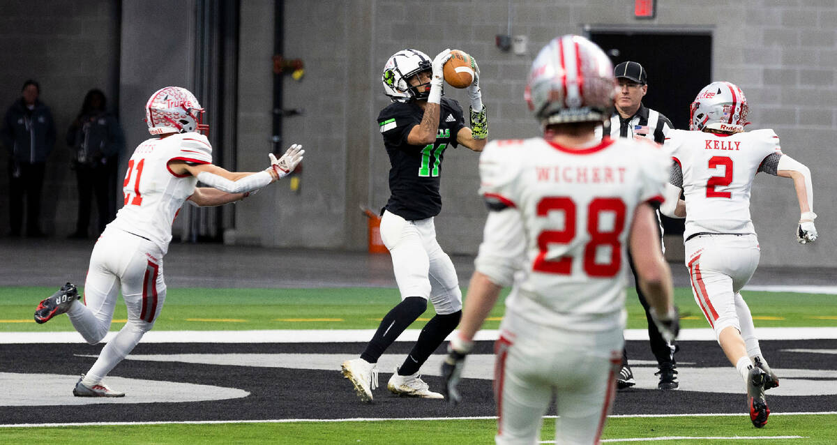 SLAM Academy WR Dominick Ross (11) secures a touchdown reception over Truckee CB Colton Knotts ...