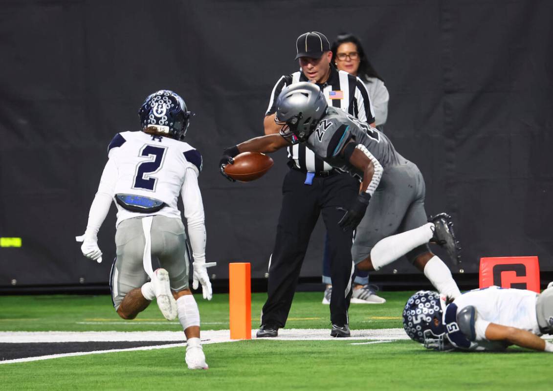 Silverado's Caden Harris (22) scores a touchdown against Shadow Ridge during the first half of ...