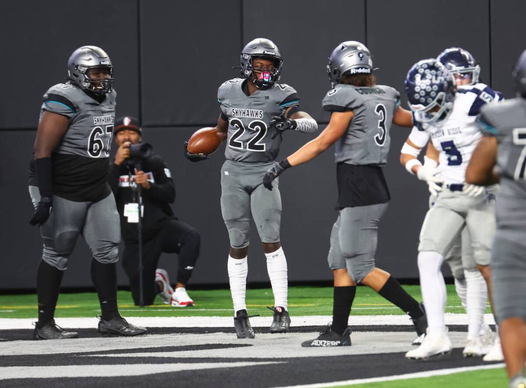 Silverado's Caden Harris (22) celebrates his touchdown against Shadow Ridge during the first ha ...