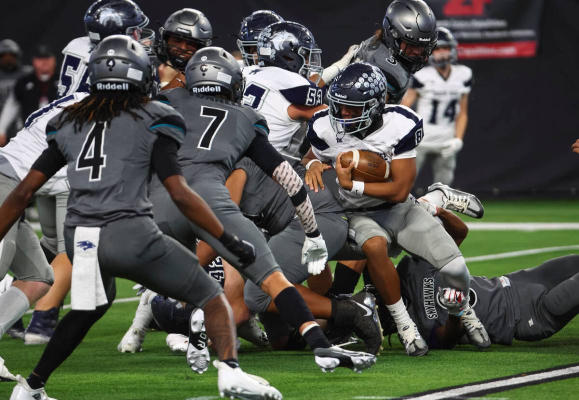 Shadow Ridge quarterback Coen Coloma (8) runs the ball against Silverado during the first half ...