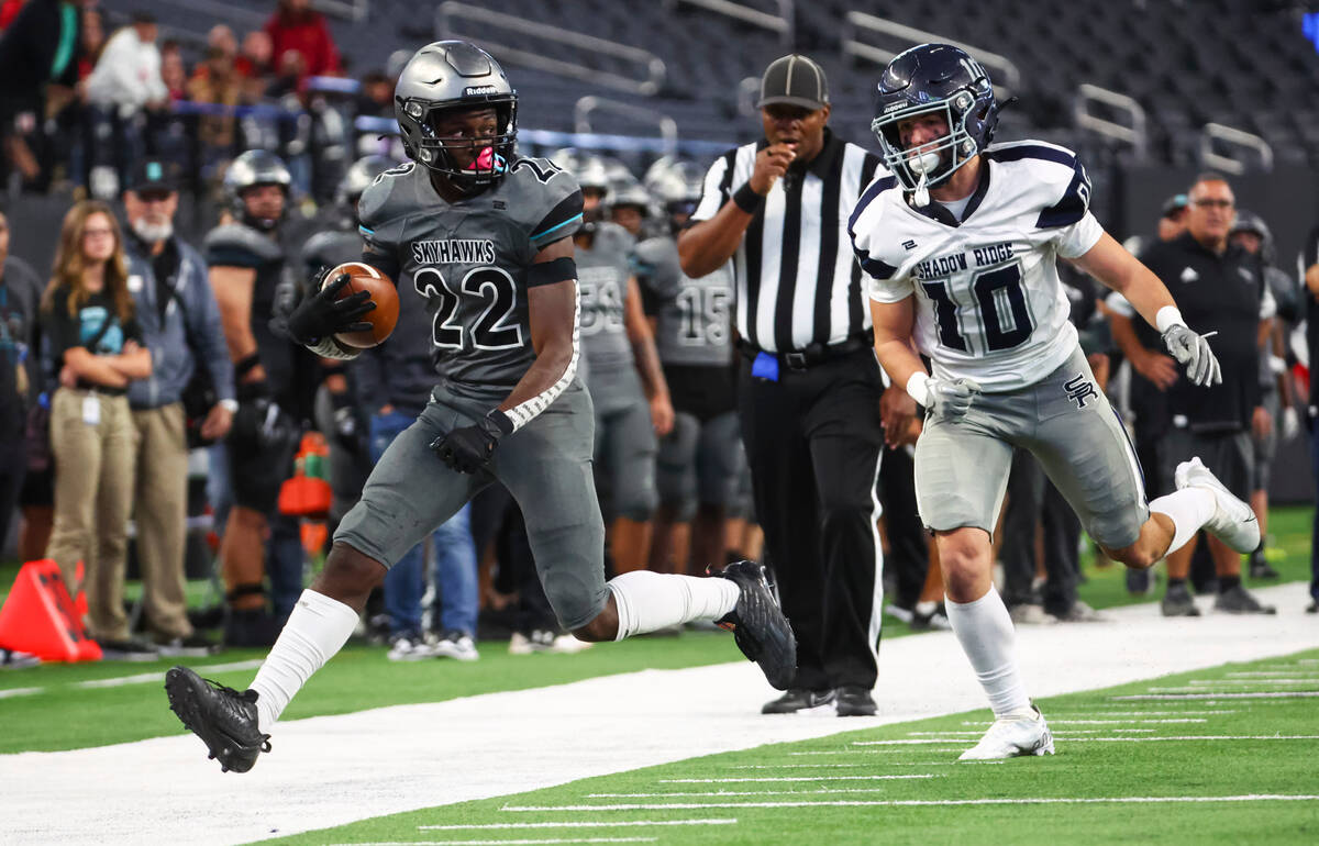 Silverado's Caden Harris (22) is forced out of bounds by Shadow Ridge's Tanner Mcdonald (10) du ...