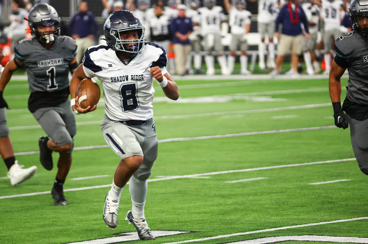 Shadow Ridge quarterback Coen Coloma (8) runs the ball to score a touchdown against Silverado d ...