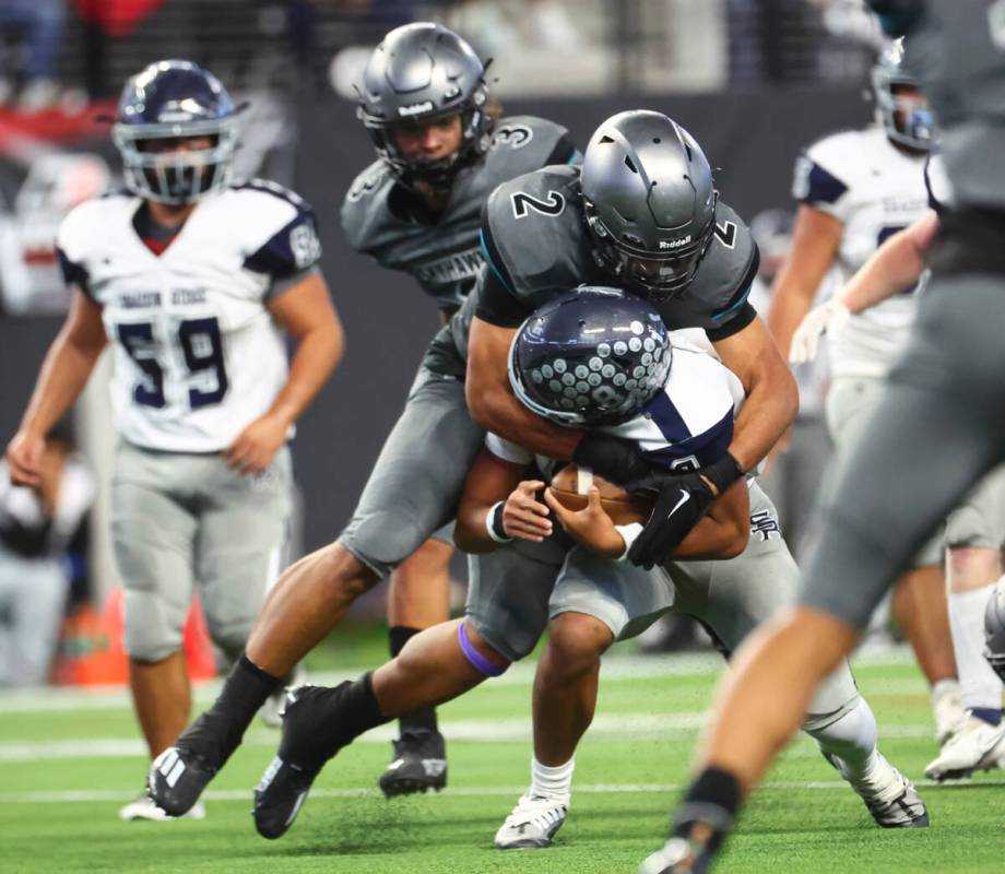 Silverado's Donavyn Pellot (2) tackles Shadow Ridge quarterback Coen Coloma (8) during the firs ...