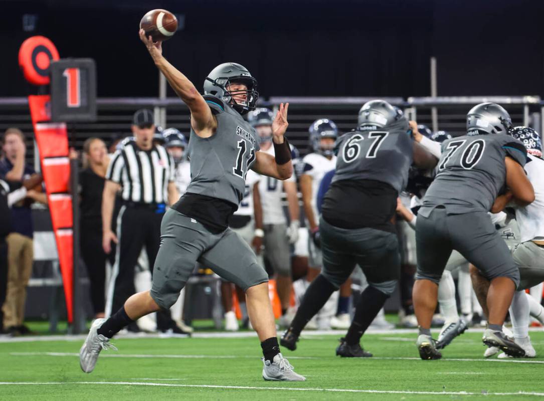 Silverado's Brandon Tunnell (11) throws a pass during the first half of the Class 4A football s ...