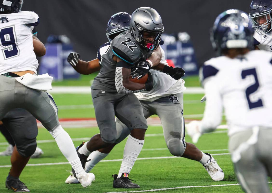 Silverado's Caden Harris (22) runs the ball against Shadow Ridge during the second half of the ...