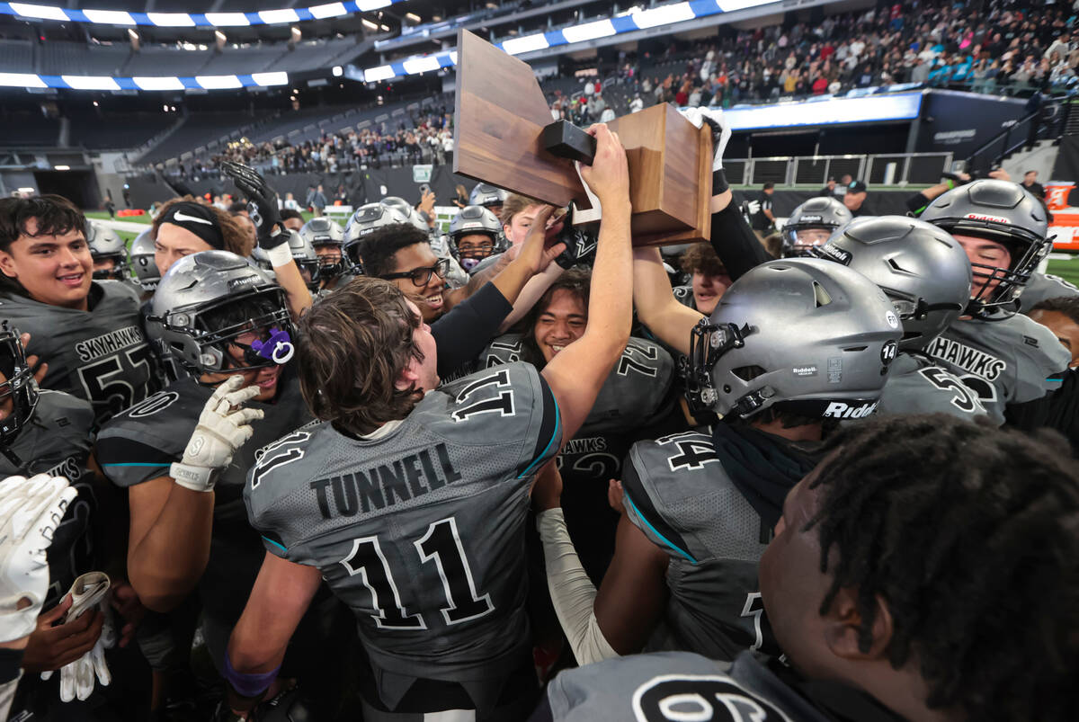 Silverado players celebrate after defeating Shadow Ridge to win the Class 4A football state cha ...