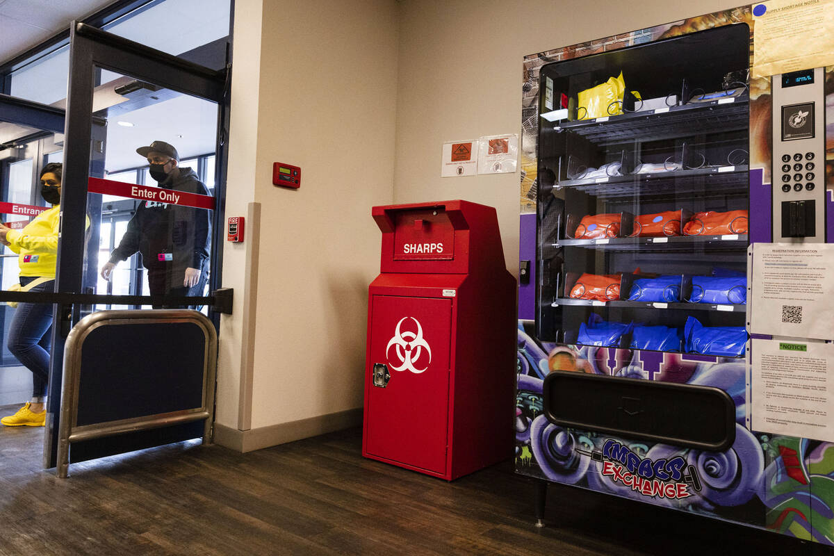 A new public health vending machine and used syringe disposal bin are displayed, as part of an ...