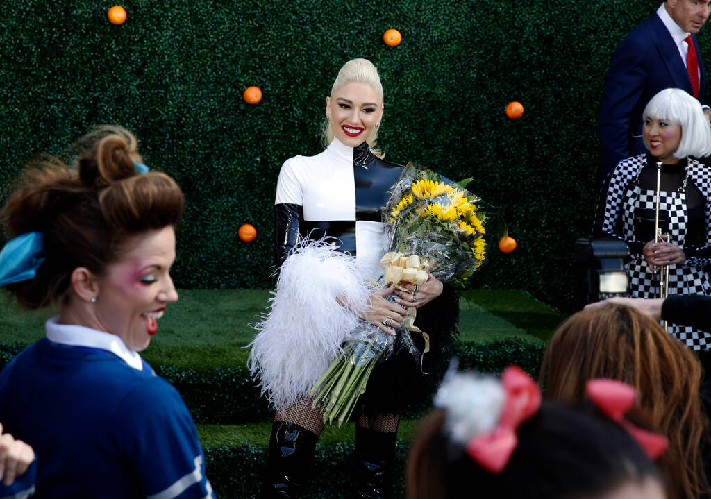 Gwen Stefani poses for photographers as she appears at an event at Planet Hollywood hotel-casin ...