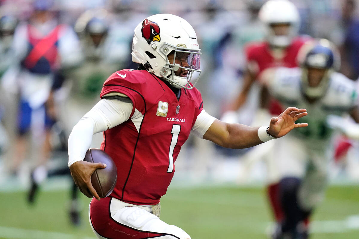 Arizona Cardinals quarterback Kyler Murray runs with the ball against the Seattle Seahawks duri ...