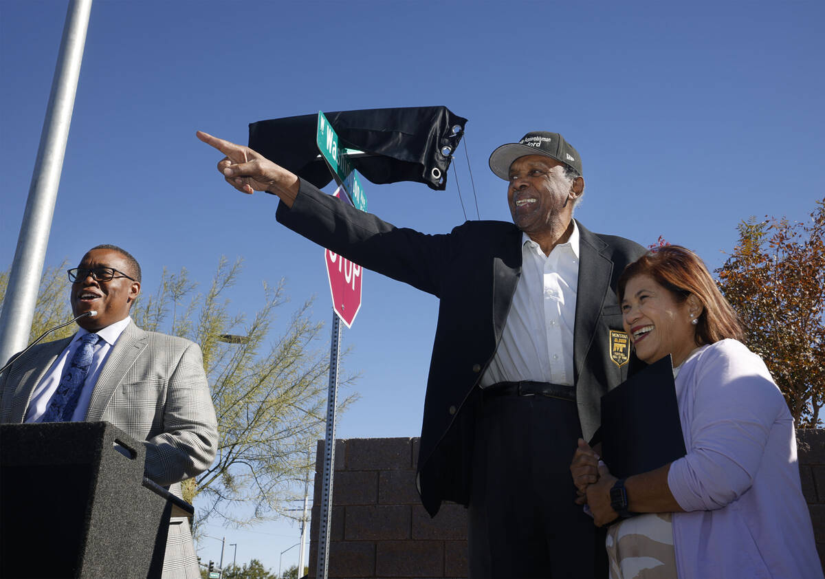 Harvey Munford, a former Nevada assemblyman and community leader, center, gestures with his wif ...