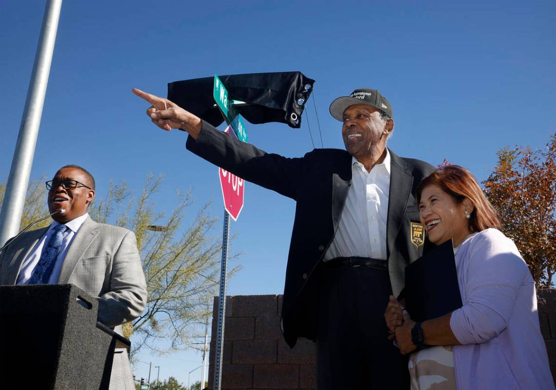 Harvey Munford, a former Nevada assemblyman and community leader, center, gestures with his wif ...