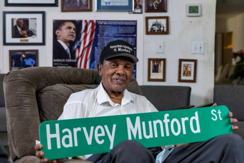 Harvey Munford relaxes at home showing off a mock up of his new street sign on Tuesday, Nov. 1, ...