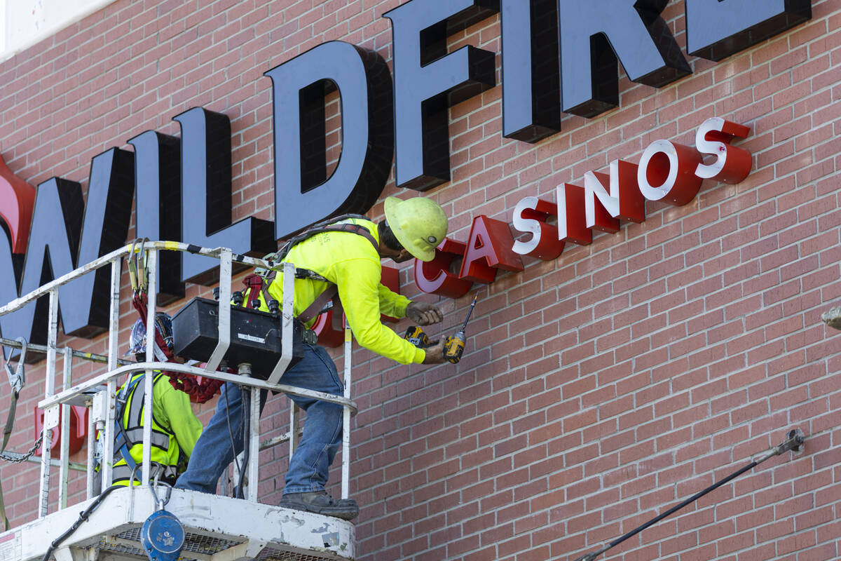 Dean Corbin of Hartlauer Signs installs signage for the new Wildfire Casino location at 2700 Fr ...