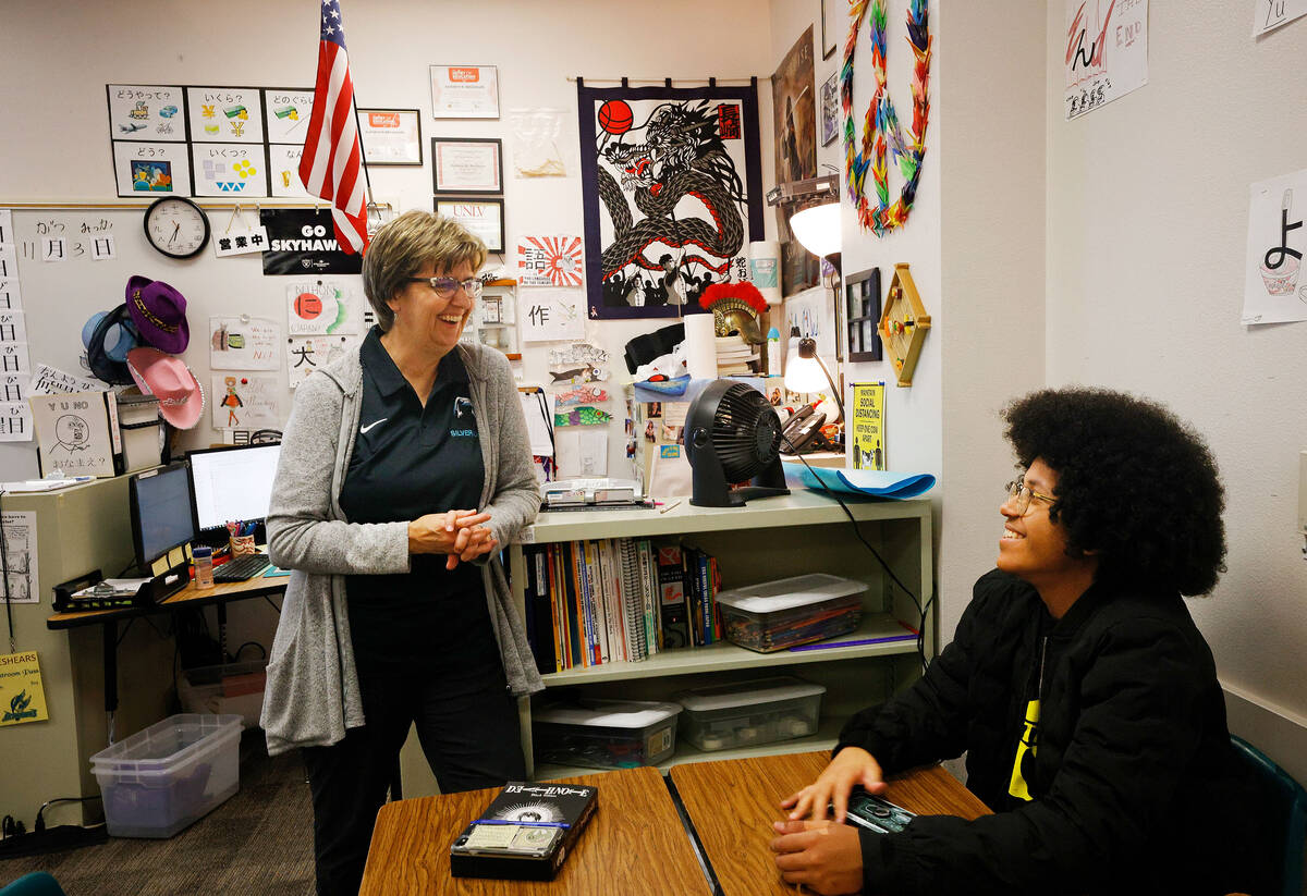 Silverado High School Japanese language teacher Kathryn Breshears talks with her student sophom ...