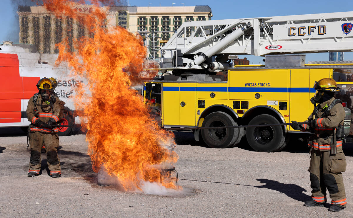Firefighters perform a holiday cooking safety demonstration using a frozen turkey in hot oil at ...