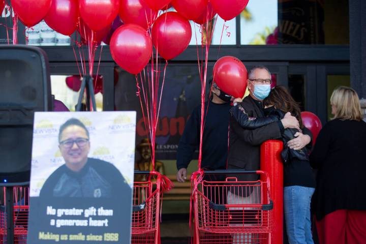 Family, friends and members of the public attend a vigil to the late Kenny Lee, the heir to Lee ...